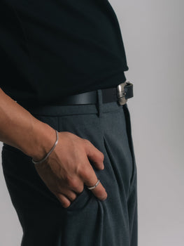 A man wearing a silver chain bracelet